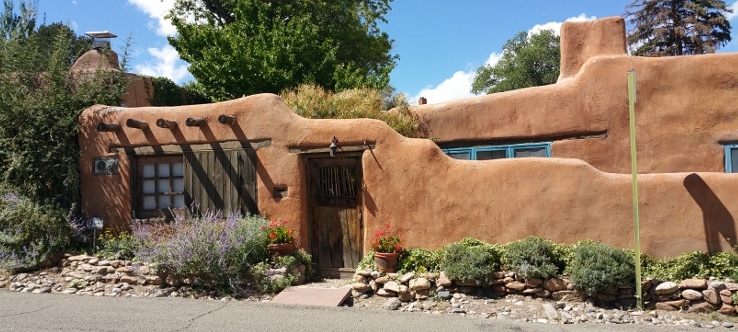 adobe fence and building
